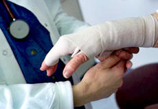 a doctor treating a patient's hand