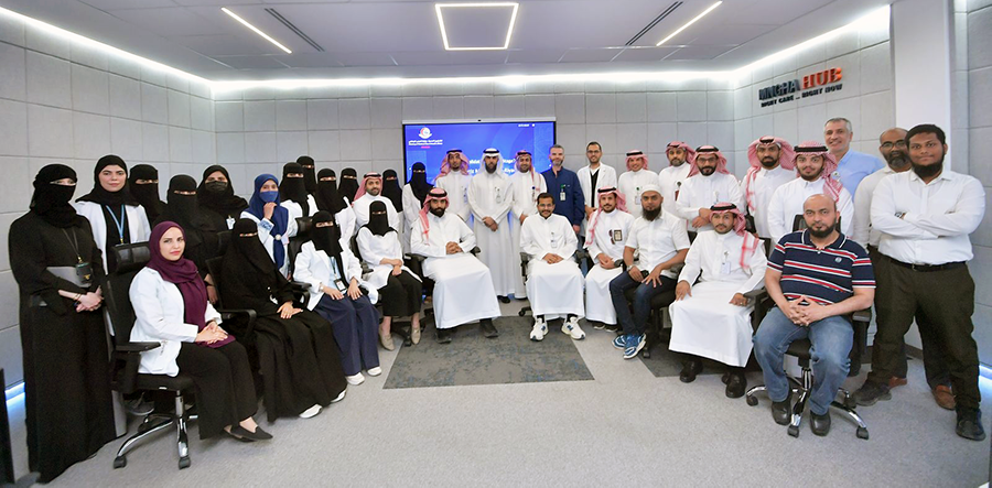 صورة جماعية لفريق الشؤون الصحية بوزارة الحرس الوطني المساهم في تحقيق اعتماد نموذج نضج أنظمة التحليلات للبيانات